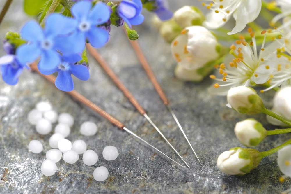 A close up of some needles and flowers