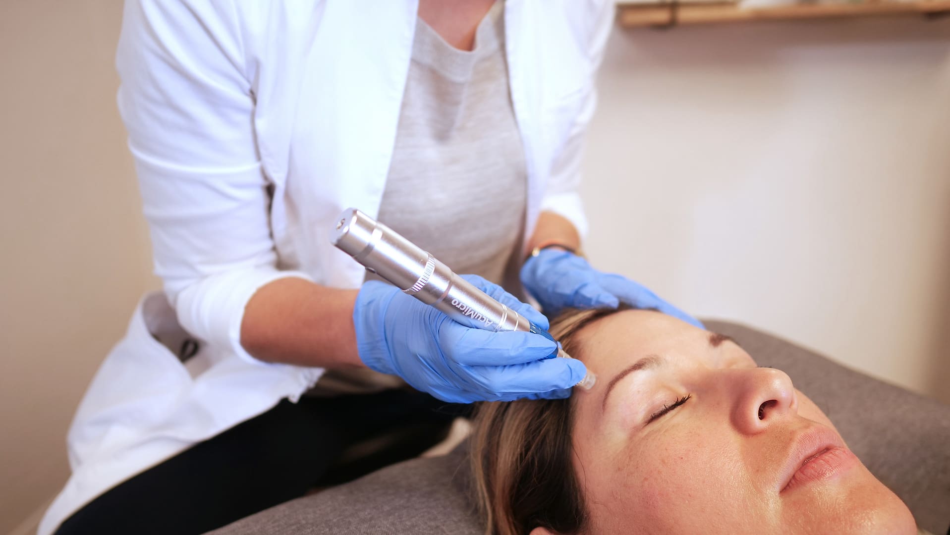 A woman getting her face microdermabrasion procedure done.